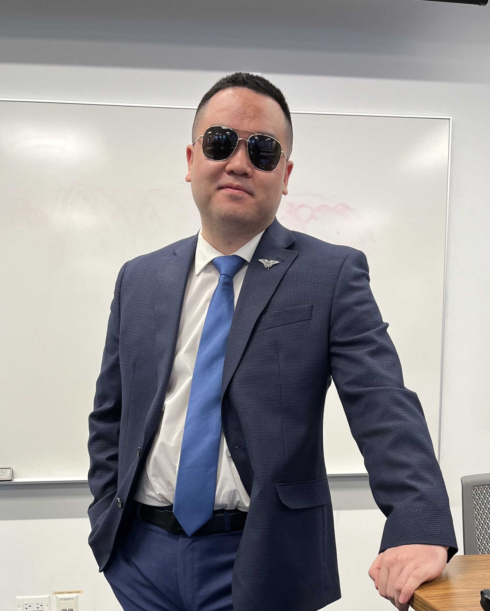 Haoran Zheng in a blue suit